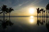 Sunset over the main pool, Hotel Taj Exotica Resort & Spa, Mauritius