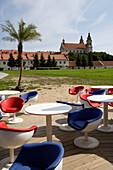 Pool bar on the river Neris, in the back the church of St. Raphael, Lithuania, Vilnius