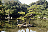 Upper pond garden. Kinkakuji Temple. Reconstructed over the original temple burned in 1950. Added to Unesco s World Heritage List in 1994. Kyoto, Kinki (Kansai) Region. Japan.
