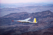 Glider in flight at dusk