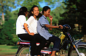 Women driving a motorbike in Angkor. Siem Reap. Cambodia