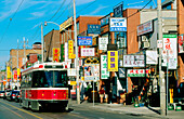 Streetcar passing by chinatown in Toronto. Ontario. Canada