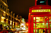 Telephone booth at night. London. England