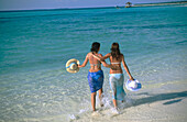 Women on the beach in Ari Atoll. Maldives