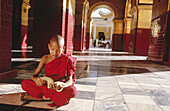 Child monk portrait. Maha Muni Pagoda. Mandalay. Myanmar (Burma).