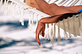 Woman on hammock on tropical beach. Caribbean
