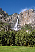 Yosmite Falls above green meadow in spring, Yosemite Valley, Yosemite National Park, California
