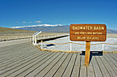 Interpretative sign on the boardwalk at Badwater (lowest point in the US) under Telescope Peak, Death Valley National Park, California