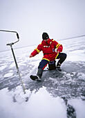 Fishing in iced lake. Lake Västersjön. Skåne. Sweden