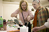 Birthday age 90, Alzheimer s patient, with care-giver at church basement. Boston. Massachusetts. USA.