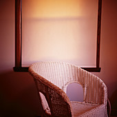 Wicker chair by window