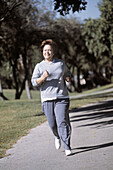 Mature woman jogging outdoor, Florida