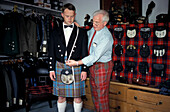 Tailor taking measurements for a jacket, traditional dress, Inverness Highlands, Scotland, Great Britain