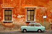 Wall of house with a Fiat 850 in front, Trastevere, Rome, Italy