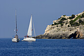 Two sailing boats in front of the caves at west coast, Ionian Islands, Greece