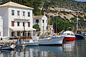 Boats moored in Gaios harbour in the sunlight, Ionian Islands, Paxos, Greece