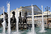 Fountain on Manege square with the Manege building, Moscow, Russia