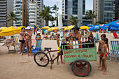 Vendor with cart selling fruit juice drinks on the beach, Recife, Pernambuco, Brazil, South America