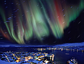 Aurora borealis in Northern Norway, star traces due to earths rotation, Hammerfest, Norway, Europe