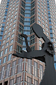 Sculpture of a man hammering in front of the Messeturm, Trade Fair Tower, (Artist: Jonathan Borofsky), Frankfurt, Hesse, Germany