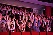 Audience Participation during a performance of the musical Five Guys Named Moe at The English Theatre, Frankfurt, Hesse, Germany
