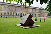 A sculpture and joggers in front of Museum Alte Pinakothek, Munich, Bavaria, Germany