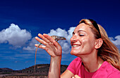 Tourist and Blue whiptail lizard, Cnemidophorus murinus ruthveni, Netherlands Antilles, Bonaire, Bonaire, Washington Slagbaai National Park, Boka Chikitu