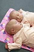 8 week old baby girls asleep twins, matching in pink