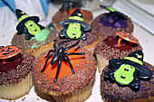 fancy buns decorated with spiders and witches
