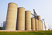Grain elevators in row along railroad tracks. Arcola. Illinois, USA
