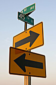 USA, Wisconsin, Kenosha. Road sign at highway intersection, arrows in two different directions, street sign, street names