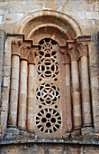 Mudejar rose windows in romanesque apse window. Church of Santa Coloma (12th century). Sierra de Ayllon. Albendiego. Guadalajara province. Castilla-La Mancha. Spain