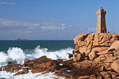 Granite coastline and lighthouse of Pors Kamor. Brittany, France