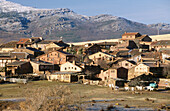 Overview of Madriguera with Ayllon mountain range at background. Segovia province. Spain