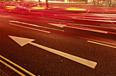 Street road sign with red backlight from cars. London. England. UK.