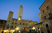 Piazza del Duomo in San Gimignano at night. Siena province. Tuscany. Italy.