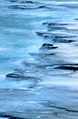 Ocean waves moving on rocks