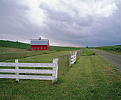 Red barn and white fence, Palouse region. Whitman County, Eastern Washington. USA