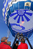 take-off of balloon, heating of the hot air balloon with passengers in gondola, Montgolfiade in Bad Wiessee at lake Tegernsee, Upper Bavaria, Bavaria, Germany