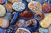 Colorful beach stones in pool of water, Southern Oregon coast