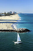 Fort Lauderdale beach with sailboat, Florida, USA.