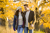 Couple taking a walk on a sunny autumn day