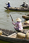 Women in boats near the market in Hoi An.