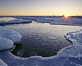 Sunset, snow and ice on the east coast of Öland, by the Baltic Sea, Sweden
