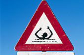 Warning sign on beach. Texel island, Holland