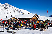 Skiers resting at mountain restaurant Schreckfeld, First, Grindelwald, Bernese Oberland, Canton of Bern, Switzerland