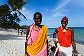 Two Massai wearing traditional clothing at Shanzu Beach, Coast, Kenya