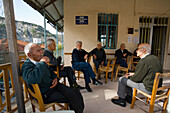 Older men sitting in a cafe, Kafenion, Pano Panagia, Troodos mountains, South Cyprus, Cyprus