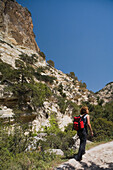 Person hiking through Avakas Gorge, Akamas Nature Reserve Park, South Cyprus, Cyprus