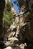 Two people hiking through Avakas Gorge, Akamas Nature Reserve Park, South Cyprus, Cyprus
